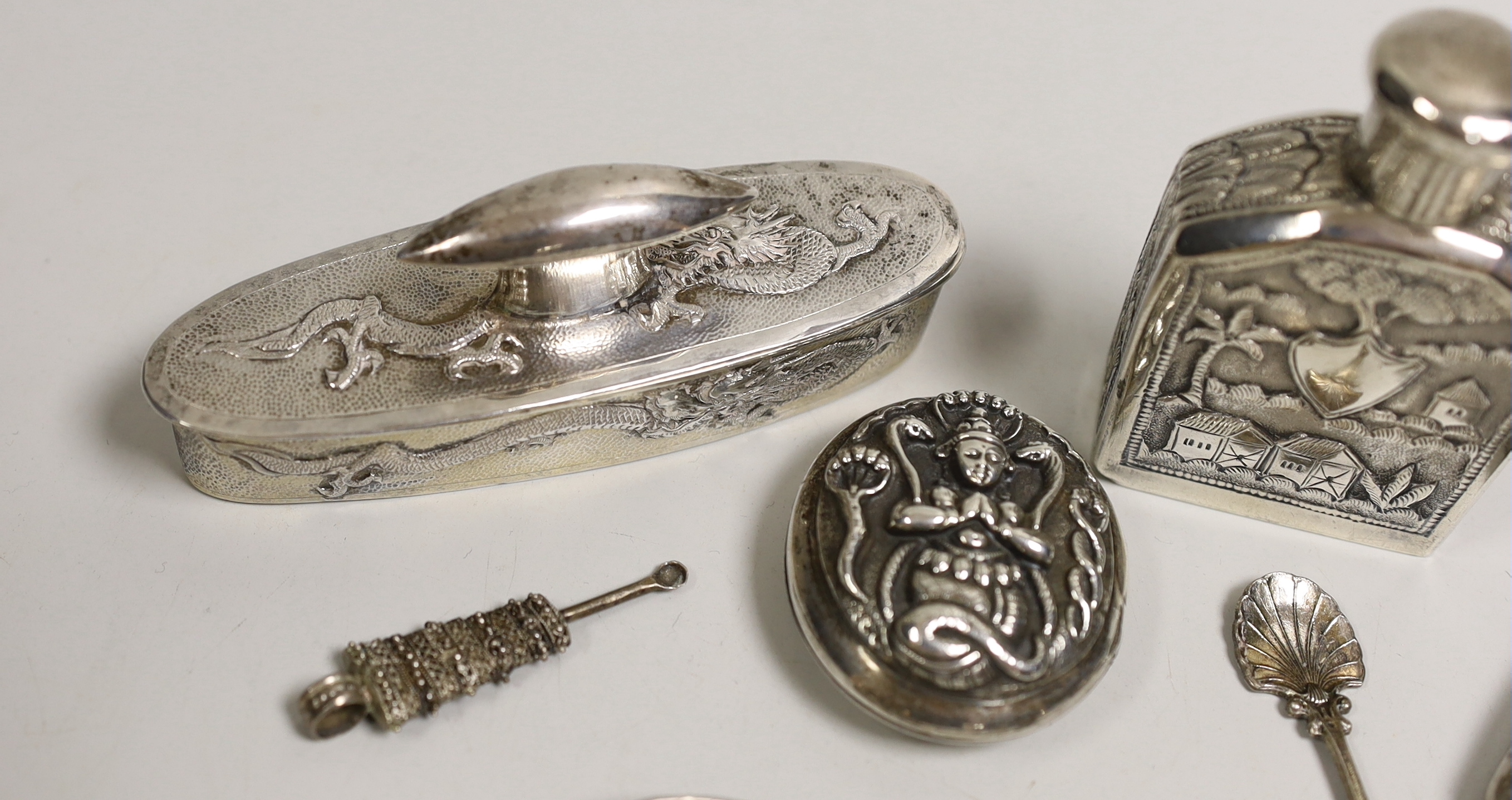 An early 20th century Chinese Export white metal oval box and cover by Wo Sing Lung, Shanghai, 11cm and six other white metal items including Indian scent bottle and oval box.